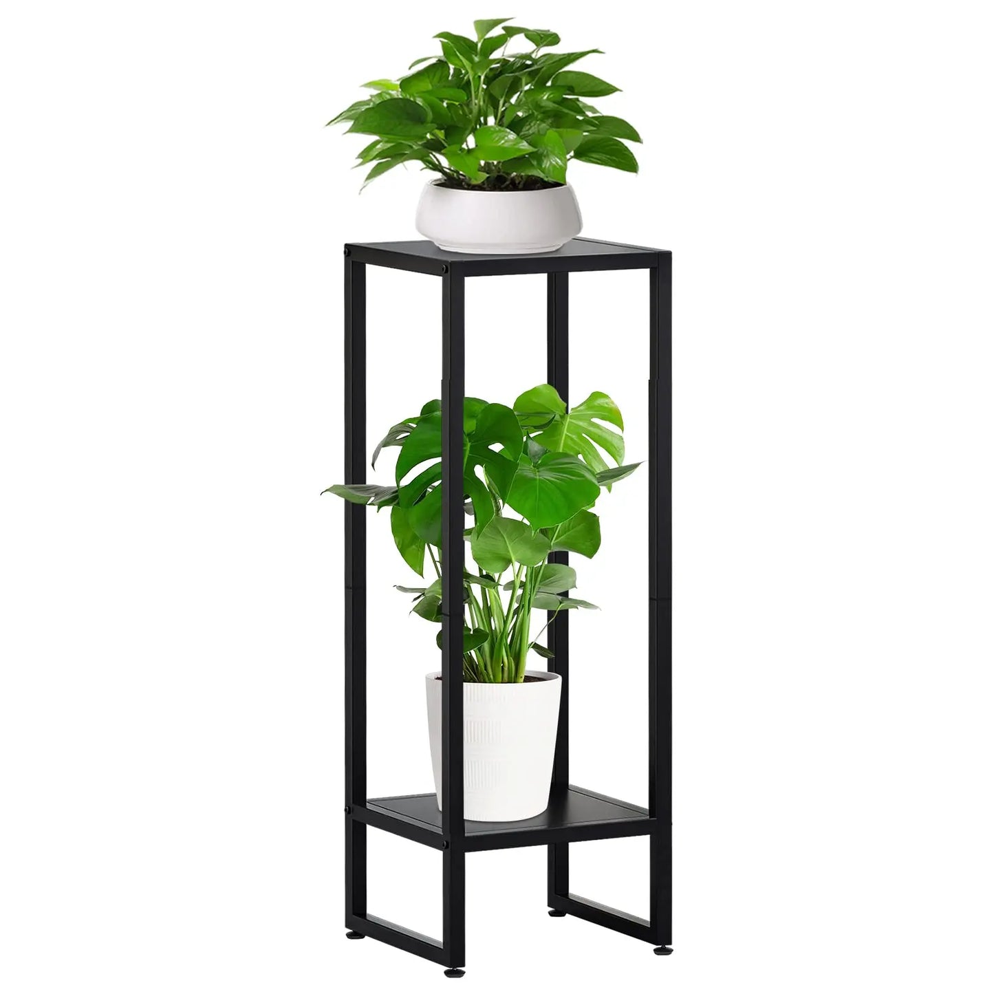 A black metal plant stand featuring two levels. The top level holds a white pot with lush green leaves, while the bottom level houses a white pot with large green leaves.